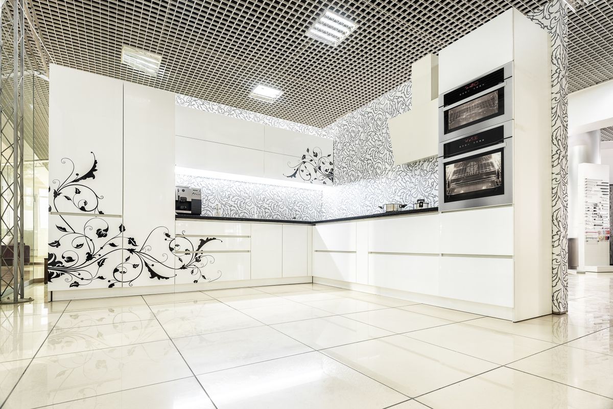 Modern white kitchen furniture. Painted front surface. The material used in the manufacture - MDF